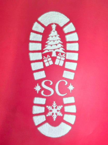 White powder santa footprint on red background